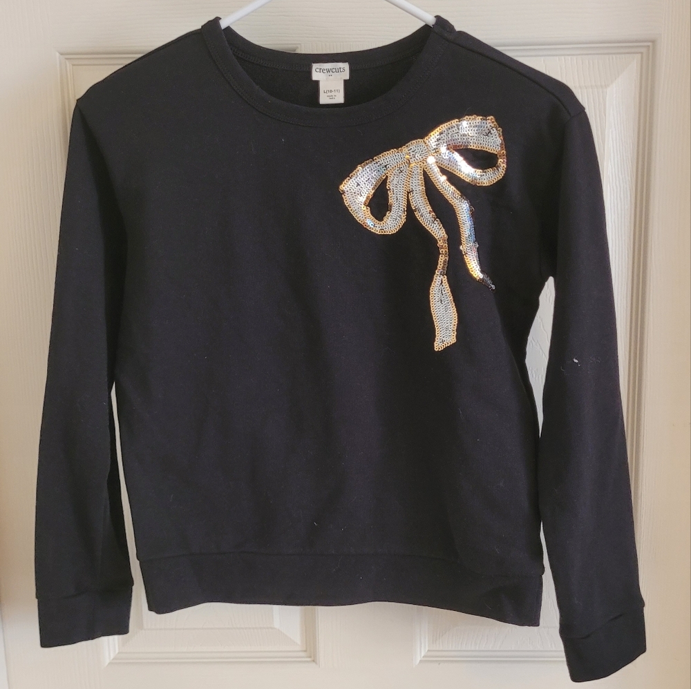 Girl's CrewCuts black top with sequin bow detail. Size large.